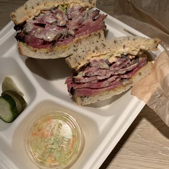 Dingfelder's Delicatessen - Pastrami Sandwich in a to go box minus some pickles - Delis Near Me - Seattle, Washington Dingfelder's Delicatessen - Pastrami Sandwich in a to go box minus some pickles - Delis Near Me - Seattle, Washington
