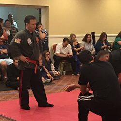 Cervizzi's Martial Arts Academy - Soke Paul looking on with grapplers at CMAA Tournament!