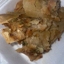 Emapanada in a tortilla and fried. Mushy and not good.