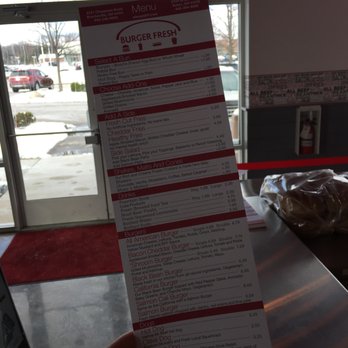 Burger Fresh - a person holding up a menu - Burgers Near Me - Solon, Ohio