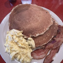 B-2 breakfast special that has 2 eggs, 2 strips of bacon and 3 pancakes B-2 breakfast special that has 2 eggs, 2 strips of bacon and 3 pancakes