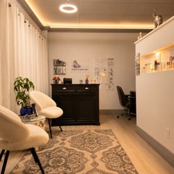 Isarat's Men's Spa - "Welcoming reception area at ISARAT'S Men's Spa, providing a clean, comfortable and relaxing experience from the moment you arrive."