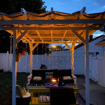 Little Projects - a patio with a fire pit - General Contractors Near Me