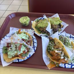 Adobado, carne, tripas, and cabeza tacos.