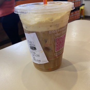 Dunkin' -  a cup of iced coffee on a table - Donuts Near Me - Cayce, South Carolina