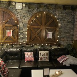 The Brazen Tavern - Back area with a fireplace