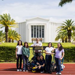 Palmer Trinity School - Students posing with their solar car project.