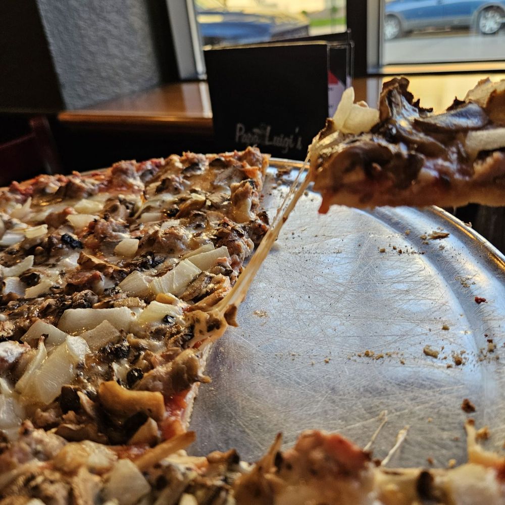 Papa Luigi's - Cheese pull - Pizza Near Me - Cudahy, Wisconsin Papa Luigi's - Cheese pull - Pizza Near Me - Cudahy, Wisconsin