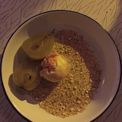 Poached pear dessert with biscuit crumbs and Campari ice cream