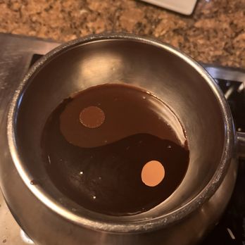 The Melting Pot - Ying yang chocolate foundu of milk chocolate and dark - Fondue Near Me - Boca Raton, Florida The Melting Pot - Ying yang chocolate foundu of milk chocolate and dark - Fondue Near Me - Boca Raton, Florida