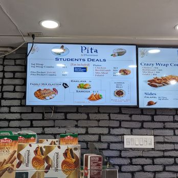 Pita and Hummus - menus on a brick wall - Middle Eastern Near Me - Toronto, Ontario