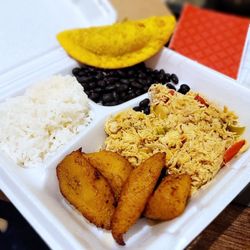 Empanadas and More - Shredded Chicken Pabellón with a beef empanada