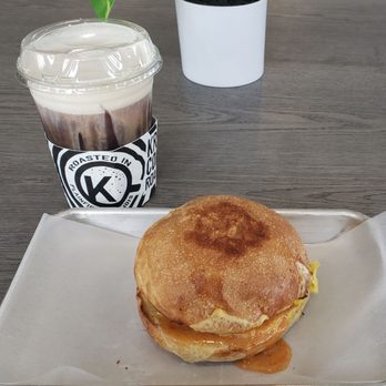 Krema Coffee Roasters - Krema cold brew with vanilla cold foam and the brown sugar bacon, gouda, egg sandwich. - Coffee & Tea Near Me - North Aurora, Illinois