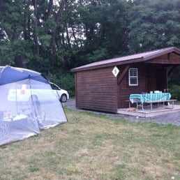 One of the rustic cabins. Plenty of space for one or even two canopy tents and a fire pit W