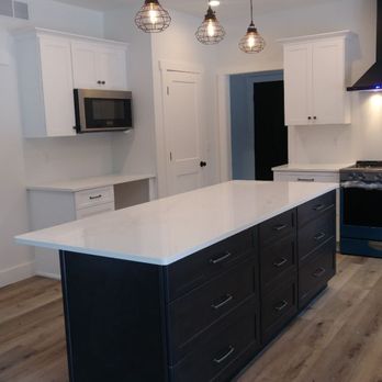 Countertop Solvers - Quartz island top with dark grey stained cabinetry. - Countertop Installation Near Me - Edinboro, Pennsylvania