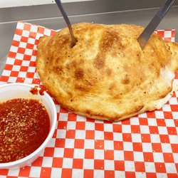 Submarinos Pizzeria - Try our HUGE calzones!!!