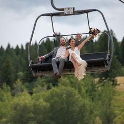 Stargazed Weddings and Events - Bride and groom riding chairlift at Buttermilk Ski Resort