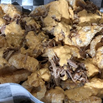 Arena Bar and Grill - Pork rind nachos with pulled pork and beer cheese - American Near Me - Tulsa, Oklahoma