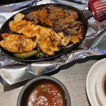 Tequila's - Combination fajitas with chicken, Carne Asada, shrimp, and veggies. Lots of flavor! - Mexican Near Me - Nashville, Tennessee