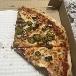 Jalapeños and mushroom pizza. Jalapeños and mushroom pizza.