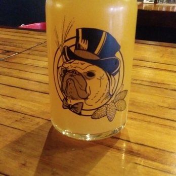 Thirsty Pug - a glass of beer on a wooden table - Beer Bar Near Me - Auburn, New York Thirsty Pug - a glass of beer on a wooden table - Beer Bar Near Me - Auburn, New York