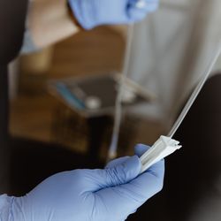 Mulberry Vitamin Infusions - Close up on a technician adjusting the drip timing for the IV.