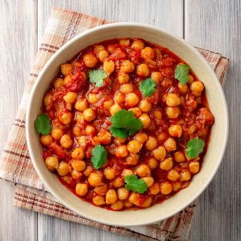 Al-Halal Zaiqa Restaurant - Chana Masala Delight: A delectable vegetarian dish featuring chickpeas simmered in a rich blend of aromatic spices, creating a flavorful. - Halal Near Me - Chicago, Illinois