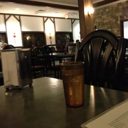 a table with a drink and menu a table with a drink and menu