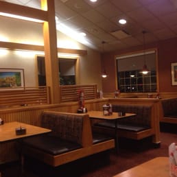 a restaurant with booths and tables a restaurant with booths and tables