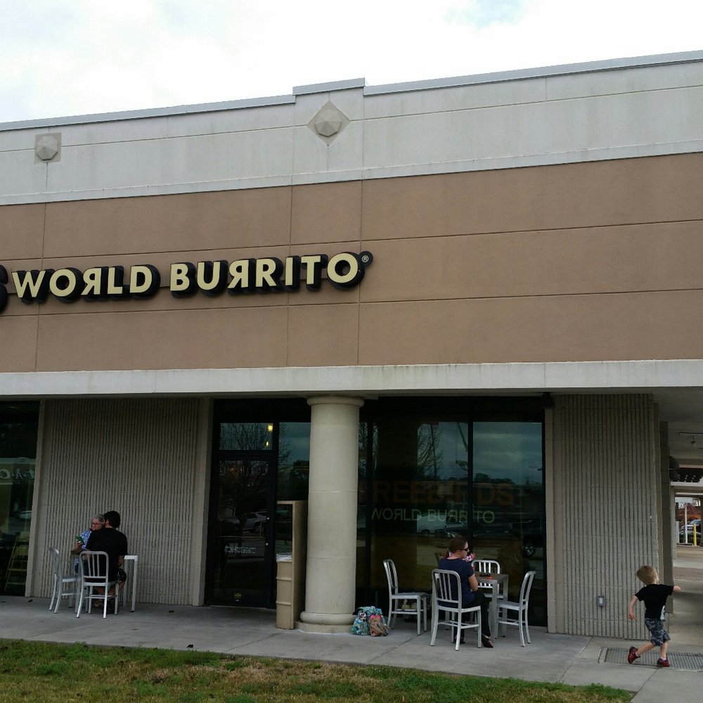 Freebirds World Burrito - Corner location in a strip mall area. Little covered patio with 5 4-top tables. - Tex-Mex Near Me - Conroe, Texas
