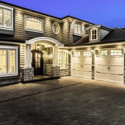 Coquitlam Retaining Walls - new construction home with driveway paving completed