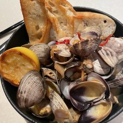 Off The Lip - Manila Clam Steamers Manila Clams Steamed in Sake-Shoyu, Finished with Cilantro and Fresno Peppers. Served with Grilled Crostini