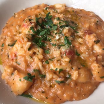 Osteria Tulia - This is just s half portion of Seafood Risotto that was split for two people. Excellent!!! - Italian Near Me - Naples, Florida Osteria Tulia - This is just s half portion of Seafood Risotto that was split for two people. Excellent!!! - Italian Near Me - Naples, Florida