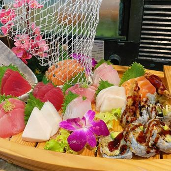 Osaka - a variety of sushi on a wooden boat - Japanese Near Me - Hampstead, New Hampshire