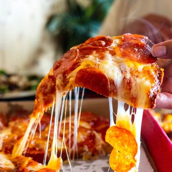 Coconut Kenny's Pizza - Lynden - A delicious slice of pizza, hot and ready to eat. - Pizza Near Me - Lynden, Washington