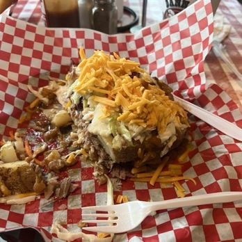 Danna's Bar-B-Que and Burger Shop - Half way through the loaded potato when I thought to take a picture - Barbeque Near Me - Branson, Missouri