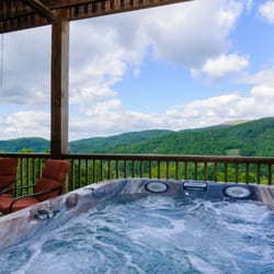 Distinctive Mountain Lodging - Some cabins have hot tubs with gorgeous mountain views.