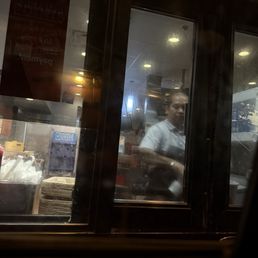 Server/Employee handling our food Server/Employee handling our food