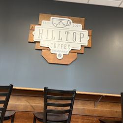 Hilltop Coffee - The bar is made of old wooden bleachers for the original shop, that used to be a school. Great use of repurposing.