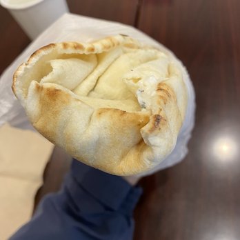 Best Falafel - a person holding a pita - Middle Eastern Near Me - Vancouver, British Columbia Best Falafel - a person holding a pita - Middle Eastern Near Me - Vancouver, British Columbia