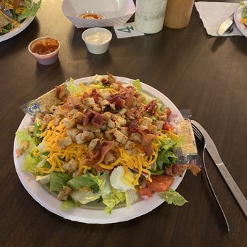 Irish Circle - a plate of salad and a glass of orange juice - Pubs Near Me - Wapella, Illinois