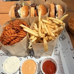 Griddle Burger with tomato and lettuce for an upcharge. Sweet potato waffle fries and fries with aioli, house sauce and ketchup.