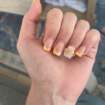 Papio Nails and Spa - This is a picture of my nails after being fixed with the incorrect nude color and the new flower. This photo was taken on the 15th. - Nail Salons Near Me - Papillion, Nebraska Papio Nails and Spa - This is a picture of my nails after being fixed with the incorrect nude color and the new flower. This photo was taken on the 15th. - Nail Salons Near Me - Papillion, Nebraska