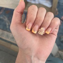 This is a picture of my nails after being fixed with the incorrect nude color and the new flower. This photo was taken on the 15th.