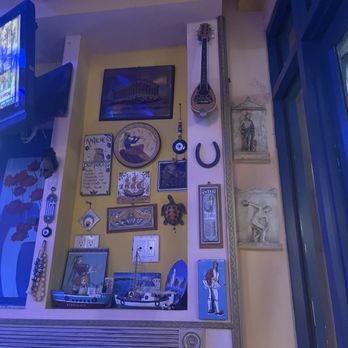 Greek Express - a living room with a guitar and a television - Greek Near Me - Bronx, New York Greek Express - a living room with a guitar and a television - Greek Near Me - Bronx, New York