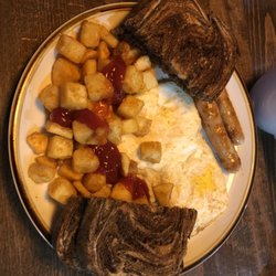 Highland Restaurant - The classic breakfast - with sausage links, marbled rye and deep fried home fries.