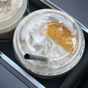 Ferlini Coffee - salted brown butter oat milk latte foam crested with dried orange slice - Coffee & Tea Near Me - San Diego, California Ferlini Coffee - salted brown butter oat milk latte foam crested with dried orange slice - Coffee & Tea Near Me - San Diego, California
