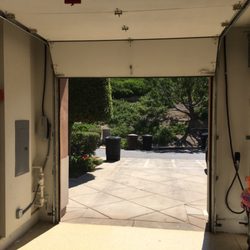 Clean Finish Electrical - Charger cord secured up and over the garage door to the center of garage for easier charging.
