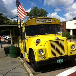 a yellow school bus parked in a parking lot