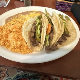 3 Carne asada tacos with rice and refried beans 3 Carne asada tacos with rice and refried beans
